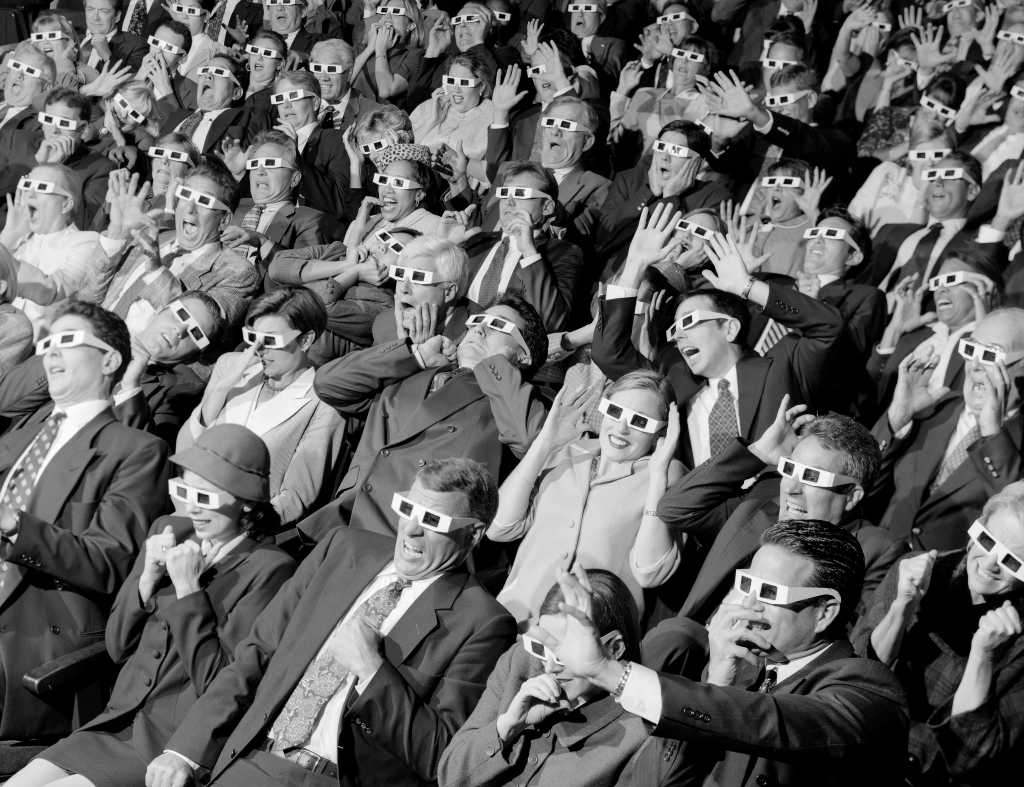 high angle view of group of spectators sitting in a movie theater wearing 3 d glasses 79072701